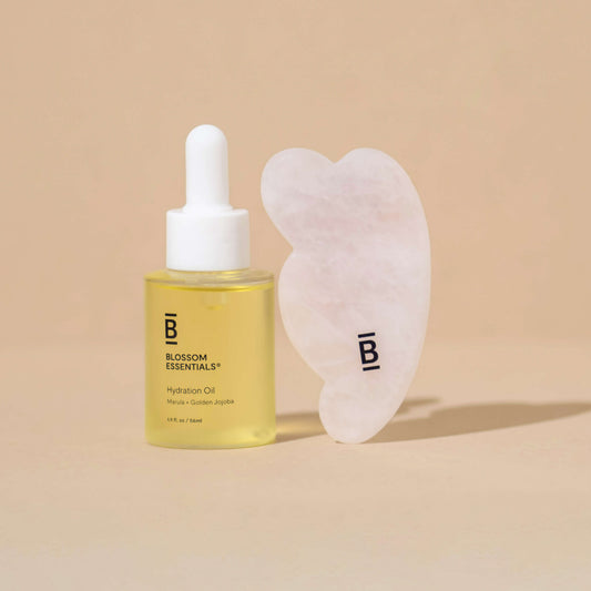selfcare kit with a gua sha stone and hydration oil